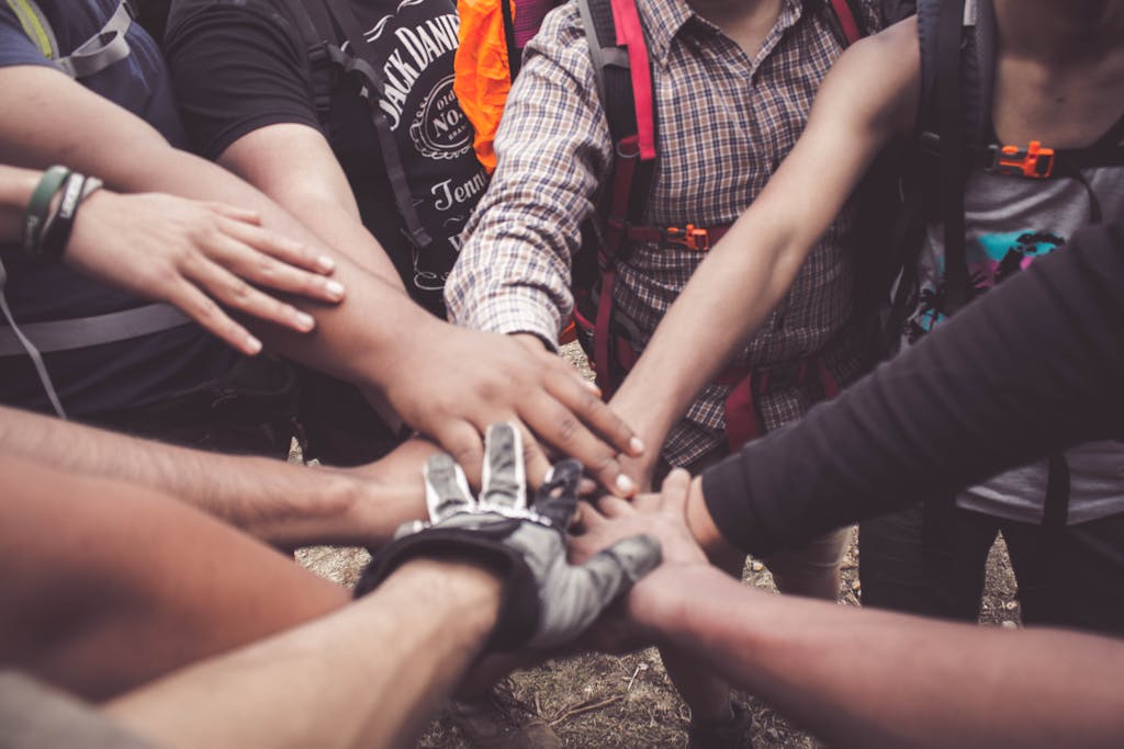 Hands stacked together in unity